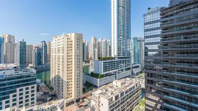 an aerial view of a city with tall buildings at Cosy 1 Bedroom Marina Apartment in Dubai