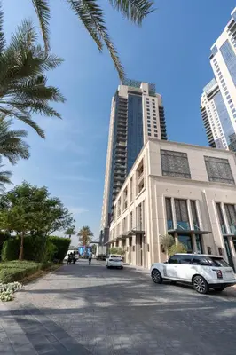 a white car parked in front of a building at Ultimate Stay / 7 people / Spacious / Dubai Creek with Marina Views in Dubai