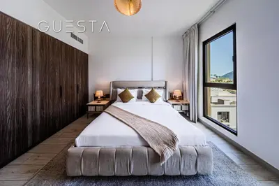 a bedroom with a large bed and a large window at Lamtara 1 - Madinat Jumeirah Living, Jumeirah in Dubai