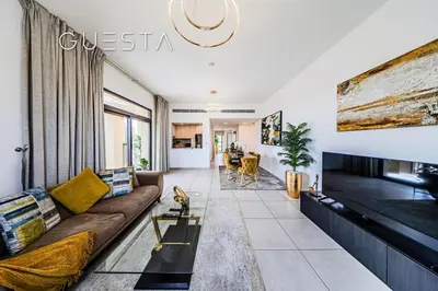 a living room with a couch and a fireplace at Lamtara 1 - Madinat Jumeirah Living, Jumeirah in Dubai