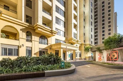 an empty street in front of a tall building at Comfy 1BD family apartment in Shams JBR in Dubai