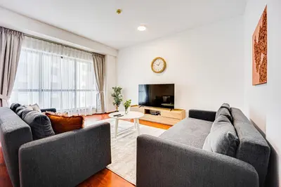 a living room with two couches and a tv at Cozy 2 BD in Bahar JBR 24 floor in Dubai