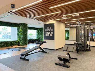 a gym with exercise equipment in a building at Mira Holiday Homes - Serviced apartment in Downtown in Dubai