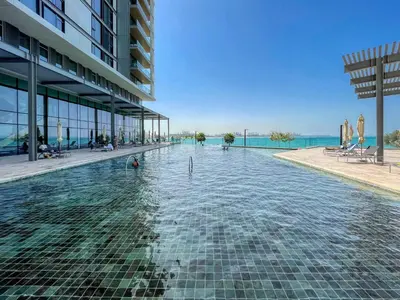 a swimming pool in the middle of a building at Welcome Home - Bluewaters brand new 2-bedroom in Dubai