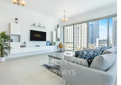 a living room with a couch and a large window at 2 Bed Room in Attessa Tower, Dubai Marina by Desert City Stays in Dubai