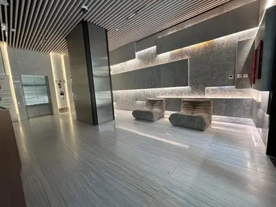 a lobby with a bench in a building at O2R26- Elegant Studio in O2 Residential Tower in Dubai