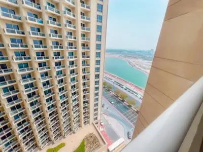 an aerial view of a large building and the ocean at LS10-Well Designed Studio In Lake Side Tower A in Dubai