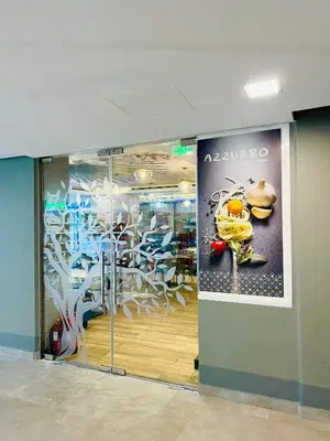 a store window with a large advertisement on the wall at Vacay Lettings - Silverene Marina Retreat - Waterfront Apartment Steps from Marina Mall in Dubai