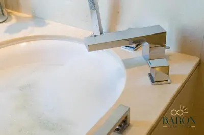a sink with a faucet in a bathroom at The Timeless in Dubai