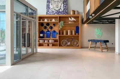 a room with a ping pong table in a building at Frank Porter - Collective Tower 1 in Dubai