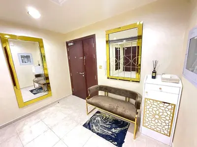 a dressing room with a chair and a mirror at Dubai Marina Gem - Elite Residences 1BHK Retreat 4501 in Dubai