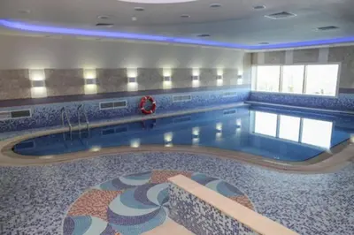 a large swimming pool in a building at Dubai Marina Gem - Elite Residences 1BHK Retreat 4501 in Dubai