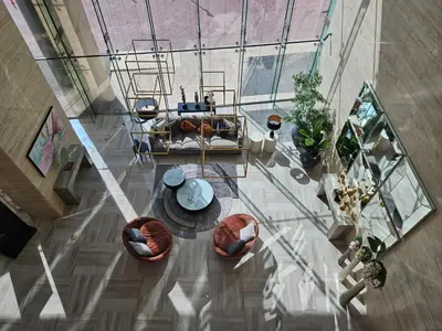 an overhead view of a living room with a table at Vacay lettings - Upgraded studio at Damac tower JVC in Dubai