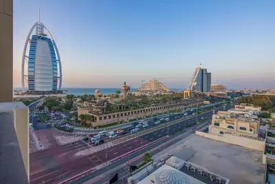 a view of a city with buildings and a freeway at Burj Al Arab View - 1BR in MJL Lamtara 1- Burj Al Arab View 703 in Dubai