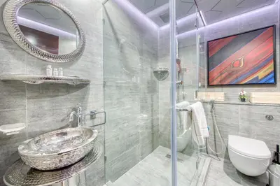 a bathroom with a sink and a glass shower at Tiara Residence Ruby, Palm Jumeirah - Mint Stay in Dubai