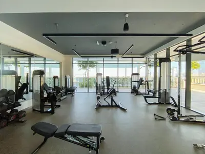 a gym with a lot of treadmills and machines at Free Beach Access! Beautiful Palm Jumeirah & Dubai Eye in Dubai