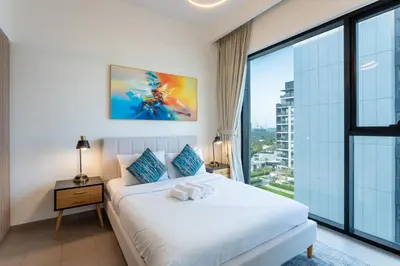 a bedroom with a bed and a large window at Vacationer I Executive 1 Bedroom I Free Parking & Wi-Fi in Dubai