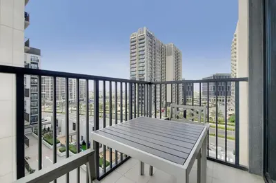 a balcony with a table and a view of a city at Vacationer I Executive 1 Bedroom I Free Parking & Wi-Fi in Dubai