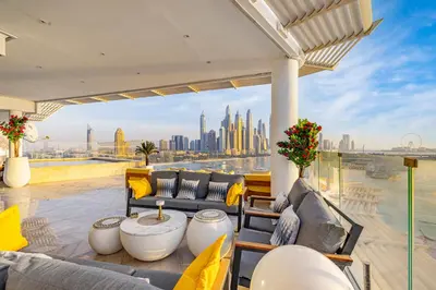 a patio with a view of the dubai skyline at FIVE Palm Jumeirah 2BR Luxury Penthouse, Private Pool, Full Marina Sea View in Dubai