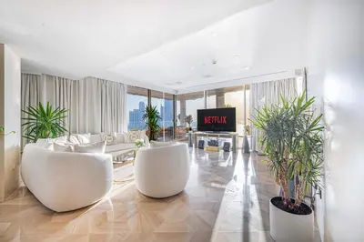 a living room with white furniture and plants in it at FIVE Palm Jumeirah 2BR Luxury Penthouse, Private Pool, Full Marina Sea View in Dubai