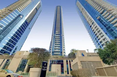 a tall building in the middle of two buildings at Bay Central, Central Tower - Tranquil Two Bedroom in Dubai