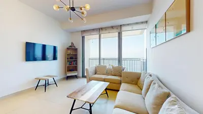 a living room with a couch and a table at 5242 Tower 2 - Light One Bedroom in Dubai