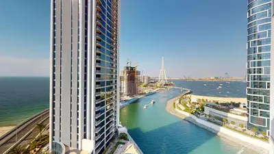 a view of the ocean between two tall buildings at 5242 Tower 2 - Light One Bedroom in Dubai