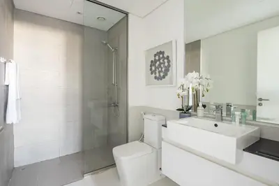 a bathroom with a toilet and a sink and a shower at Frank Porter - Pulse C2 in Dubai