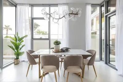 a dining room with a table and chairs at Frank Porter - Pulse C2 in Dubai