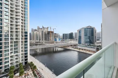 a view of a river in a city with buildings at ALiving Luxury Studio I DAMAC Maison Prive A- 1007 in Dubai