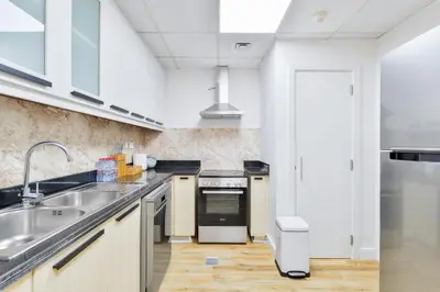 a kitchen with a sink and a stove at Luxury JBR · Marina View · 5* Beach Resorts Access in Dubai