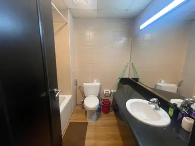 a bathroom with a toilet and a sink at Stylish Studio in Discovery Garden MED100 in Dubai