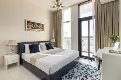 a bedroom with a large bed and a large window at Frank Porter - Starz by Danube in Dubai