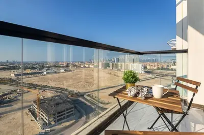 an apartment balcony with a view of a city at Frank Porter - Starz by Danube in Dubai
