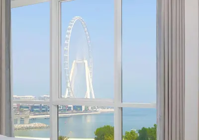 a view of the london eye from a window at Ultra Luxe 5BR Al Bateen I Private Beach and Pool I JBR Full Sea View Beachfront in Dubai
