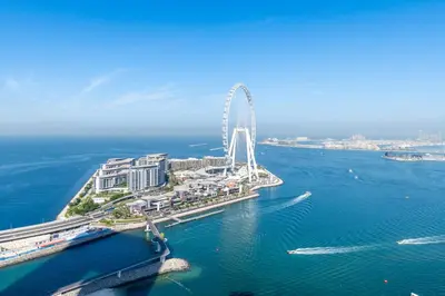an aerial view of a ferris wheel in the water at Ultra Luxe 5BR Al Bateen I Private Beach and Pool I JBR Full Sea View Beachfront in Dubai