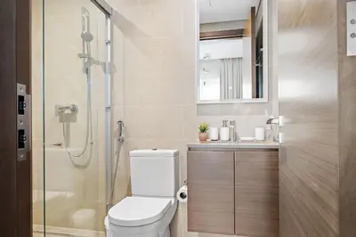a bathroom with a toilet and a shower at Beautiful 2 bedroom next to Business Bay - Sobha Creek Vista in Dubai