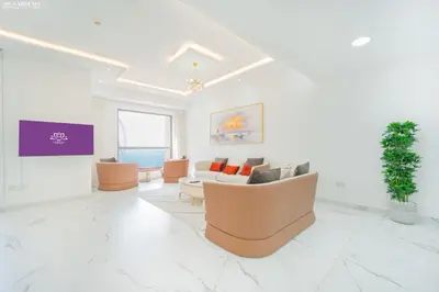 a large living room with a couch and chairs at JBR - Shams Suites - Sea & Marina View Walking Distance to The Beach by Gardenia in Dubai