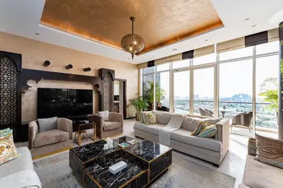 a living room with a couch and a table at Tiara Residences, Palm Jumeirah Dubai - Mint Stay in Dubai