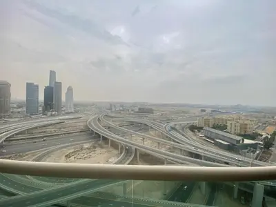 a view of a highway in a city with buildings at Manchester Regency - 2BR Apartment in Dubai Marina in Dubai