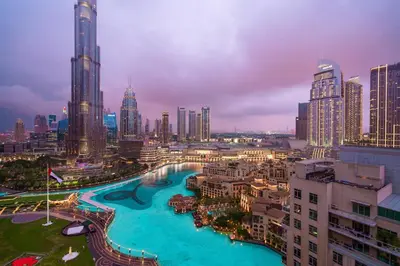 a view of a city with tall buildings and a river at Elite Royal Apartment - Full Burj Khalifa & Fountain View - Majesty in Dubai