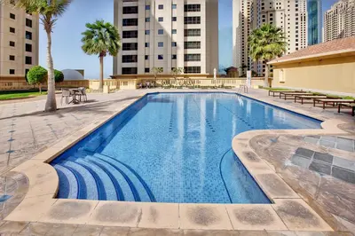 a swimming pool in the middle of a city at Nice and comfy 2BD apartment in Jbr in Dubai