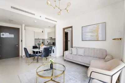 a living room with a couch and a table at New 2 bedroom in Meydan - Burj Khalifa View in Dubai