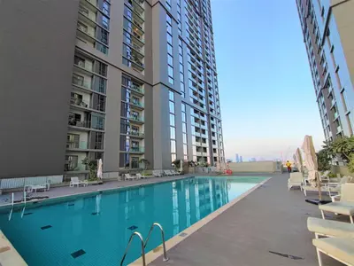 a swimming pool in the middle of a building at New 2 bedroom in Meydan - Burj Khalifa View in Dubai