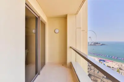 a balcony with a view of the beach and the ocean at Deluxe Retreat In JBR - Million Dollar View - Balcony in Dubai