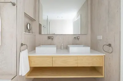 a bathroom with two sinks and a mirror at Frank Porter - Al Nabat in Dubai