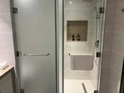 a shower with a glass door in a bathroom at Majestay - Luxury Living in Dubai