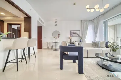a living room with a couch and a table at Harmonious 1BR at 29 BLVD Tower 1 Downtown Dubai by Deluxe Holiday Homes in Dubai