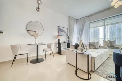 a living room with a couch and a table at Harmonious 1BR at 29 BLVD Tower 1 Downtown Dubai by Deluxe Holiday Homes in Dubai