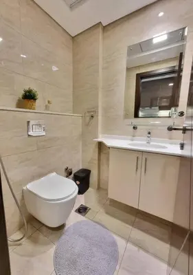 a bathroom with a toilet and a sink at Premium Lovely Studio with Balcony in Dubai in Dubai